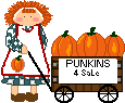 Farm girl with pumpkins in a wagon