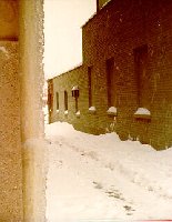 Icy drainpipe and our driveway